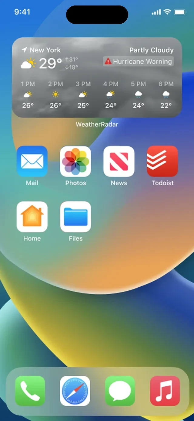 The Hurricane widget on an iPhone home screen, showing the current temperature for New York with a Hurricane Warning badge and an hour-by-hour forecast
